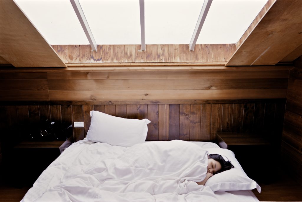 person sleeping on a bed with professional mattress cleaning Breckenridge