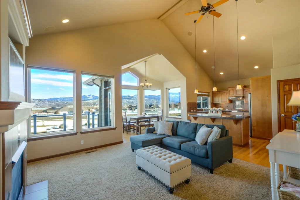 A very clean living room overlooking a mountain town landscape scene. The living room is illustrating tips for spring cleaning in Breckenridge, CO for Exclusive Cleaning and Restoration, a local carpet cleaning, floor and home restoration company in Summit County, Colorado.