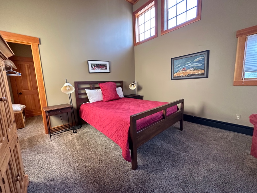 A clean made-up bed in a vacation rental bedroom in Breckenridge for the blog, Sleep Smarter: The Benefits of Professional Mattress Cleaning Service in Breckenridge